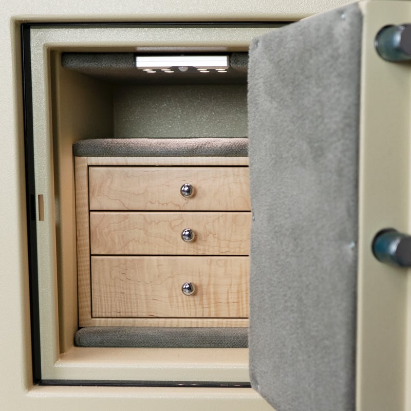 Detail — three curly maple drawers with polished chrome pulls