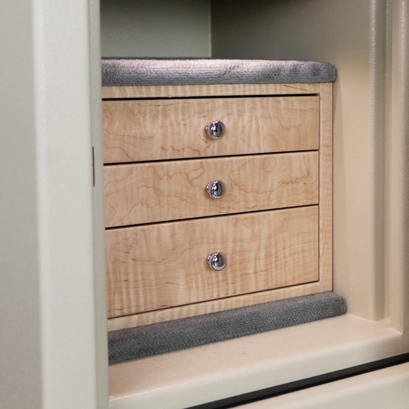 Detail — black velvet drawer interior with LED down-lighting