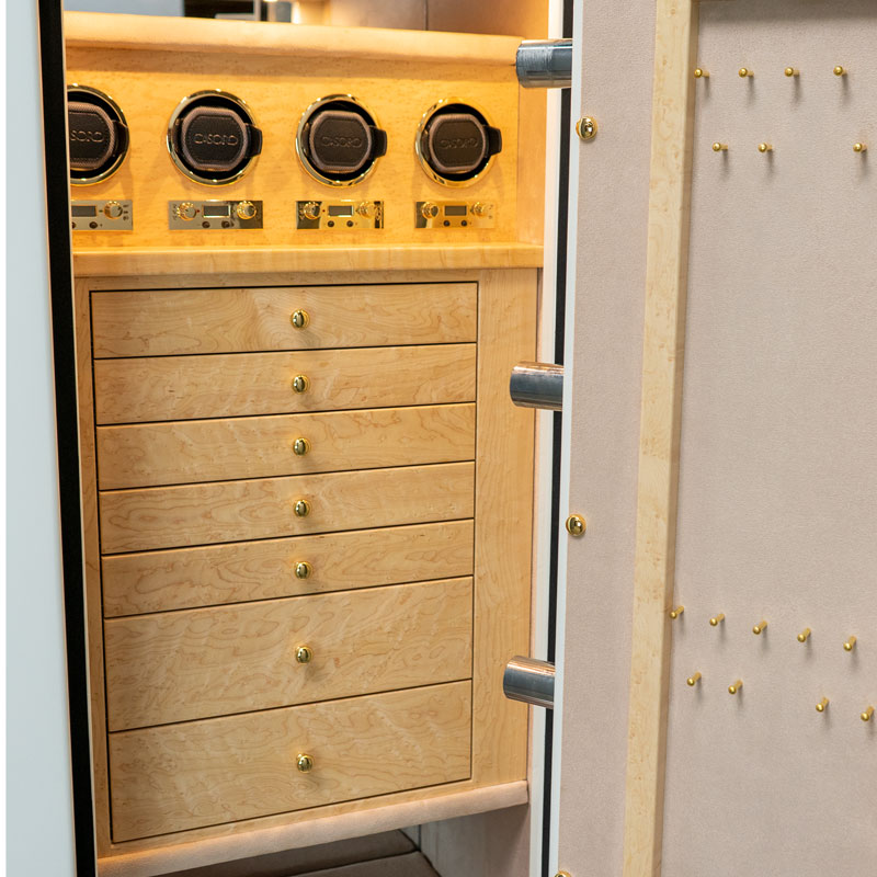 Detail — seven Birdseye Maple drawers with polished brass pulls