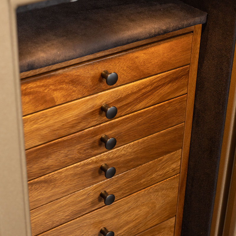 Detail — seven monkeywood drawers with matte black pulls